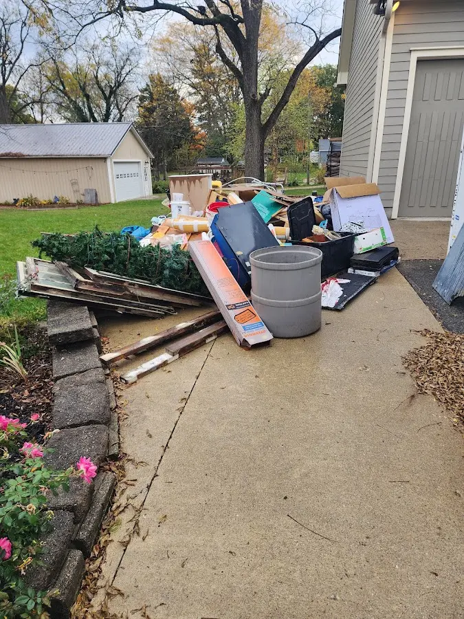 Dumpster being loaded with debris for Demolition Dumpster Rental in Plattsmouth